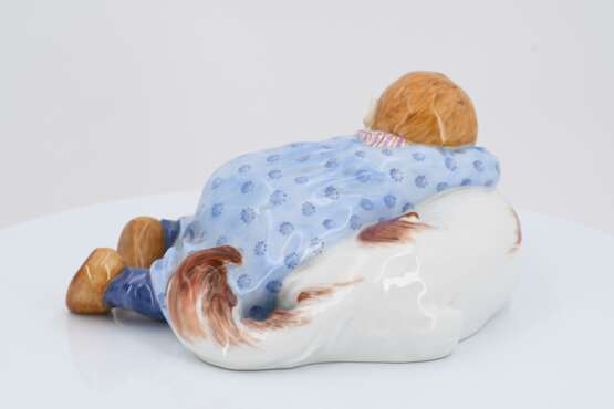 Porcelain figurine of child lying on dog - photo 5