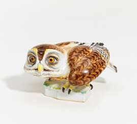 Porcelain figurine of a crouching little owl