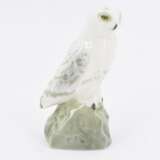 Small porcelain figurine of an arctic owl on rock - photo 2