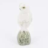 Small porcelain figurine of an arctic owl on rock - photo 3