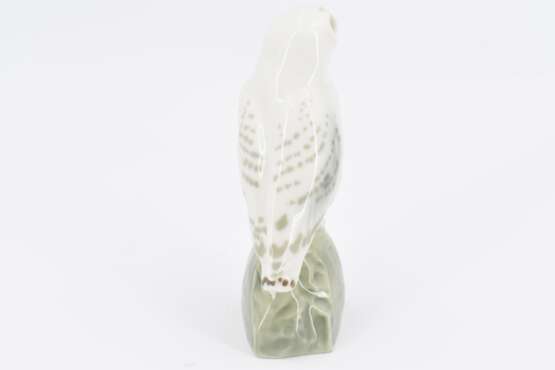 Small porcelain figurine of an arctic owl on rock - photo 5