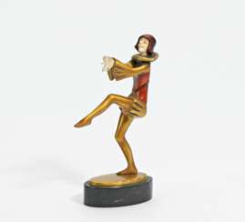 Broze figurine of harlequin standing on one leg