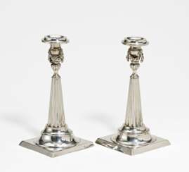 Pair of silver candlesticks with fluted shaft and festoons