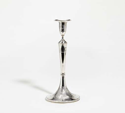 Slender silver candlestick with stylised leaf décor - photo 1
