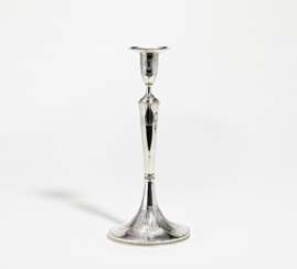 Slender silver candlestick with stylised leaf décor