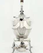 Charles Stuart Harris. Edward VII silver tea pot with gadrooned walls on rechaud