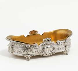 Oval silver jardinière with musical motifs and festoons
