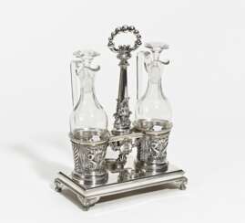 Silver oil and vinegar cruet stand with dolphin décor and lyre
