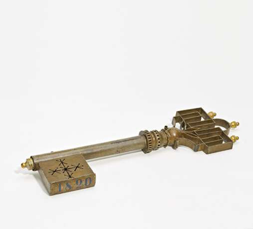 Iron and brass shop sign in the shape of a key - photo 1