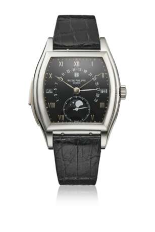 PATEK PHILIPPE. A VERY RARE PLATINUM TONNEAU-SHAPED AUTOMATIC MINUTE REPEATING PERPETUAL CALENDAR WRISTWATCH WITH RETROGRADE DATE, MOON PHASES, LEAP YEAR INDICATION, ADDITIONAL DIAL AND CERTIFICATES OF ORIGIN - фото 1