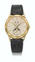 PATEK PHILIPPE. A VERY RARE AND HIGHLY ATTRACTIVE 18K GOLD AUTOMATIC PERPETUAL CALENDAR WRISTWATCH WITH MOON PHASES