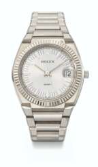 ROLEX. AN EXTREMELY RARE 18K WHITE GOLD TONNEAU-SHAPED WRISTWATCH WITH SWEEP CENTRE SECONDS, DATE AND BRACELET