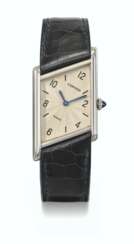 CARTIER. A RARE AND UNUSUAL PLATINUM LIMITED EDITION ASYMMETRICAL WRISTWATCH