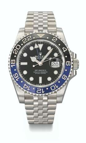 ROLEX. A STAINLESS STEEL DUAL TIME WRISTWATCH WITH SWEEP CENTRE SECONDS, DATE, BRACELET, GUARANTEE AND BOX - photo 1