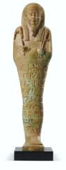 AN EGYPTIAN GREEN FAIENCE SHABTI FOR PAKHAAS