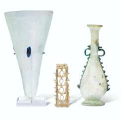 TWO ROMAN GLASS VESSELS AND AN OPENWORK JUG HANDLE