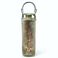 A ROMAN GREEN GLASS CYLINDRICAL FLASK WITH BRONZE HANDLE