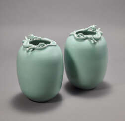 A FINE AND VERY RARE PAIR OF CELADON-GLAZED OVOID VASES WITH CHILONG APPLIQUES