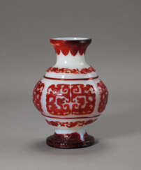 AN IMPERIAL RED-OVERLAY WHITE GLASS ‘KUI-DRAGON’ VASE