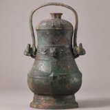 AN INSCRIBED ARCHAIC BRONZE WINE VESSEL AND COVER, YOU - photo 1