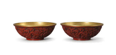 A RARE PAIR OF IMPERIAL CARVED CINNABAR LACQUER &#39;DRAGON&#39; BOWLS