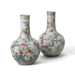 A PAIR OF SMALL FAMILLE ROSE ‘PEACH AND BATS’ BOTTLE VASES, TIANQIUPING