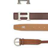 A SET OF THREE: A BRUSHED SILVER H CLASP WITH REVERSIBLE GOLD AND CHOCOLATE LEATHER BELT, A NATURAL BARENIA LEATHER BELT & A STERLING SILVER TOUAREG CLASP - photo 2