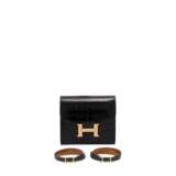 A SET OF THREE : A SHINY BLACK ALLIGATOR CONSTANCE COMPACT WALLET WITH ROSE GOLD HARDWARE & TWO BLACK CHAMONIX LEATHER REVERSIBLE HAPI BRACELETS WITH GOLD HARDWARE - фото 1