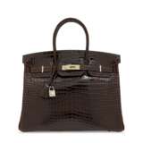 AN EXCEPTIONAL, SHINY COCOAN POROSUS CROCODILE BIRKIN 35 WITH 18K YELLOW GOLD AND YELLOW SAPPHIRE HARDWARE - photo 1