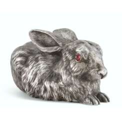 A GEM-SET SILVER BELL-PUSH IN THE FORM OF A RABBIT