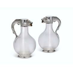 A PAIR OF PARCEL-GILT SILVER-MOUNTED CUT-GLASS CLARET JUGS