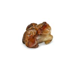 A RUSSET-BROWN JADE LION-SHAPED TOGGLE