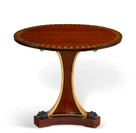 AN AUSTRIAN PARCEL-GILT AND EBONIZED MAHOGANY TEA TABLE - photo 1