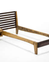 Single bed and hanging bedside table with hinged drawer and open compartment of the