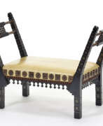Carlo Bugatti. Bench in carved and inlaid wood