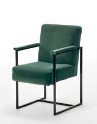 Armchair with black painted square section tubular metal frame and green velvet seat, back and armrests