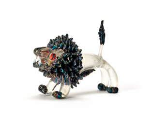 Crystal glass sculpture with mane, legs and tail applied in black glass paste, lattimo teeth, eyes and tongue in red glass paste