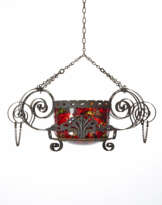 Cesendello in wrought iron and embossed iron sheet with large volutes with intertwined curls, fronts with acanthus leaves