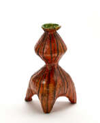 Marcello Fantoni. Bottle sculpture with tripod base in matt glazed terracotta and sub-display in orange and green with brown drips