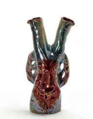Two-necked vase / sculpture depicting a face in polychrome enamelled terracotta with metallic luster