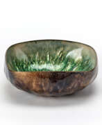 Paolo De Poli. Copper bowl worked with irregular pods and enamelled in shades of green and brown and white and pink