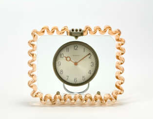 AKROM table clock with frame in clear pink transparent blown corrugated glass and nickel-plated brass frame