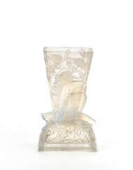 Blown mold glass vase in transparent colorless lattimo, with floral relief decorations depicting a grasshopper