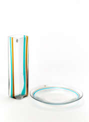 Lot consisting of a colorless transparent glass vase with two vertical bands applied in orange and blue glass