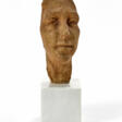 Terracotta sculpture mounted on a marble base depicting a face - Auction prices