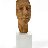 Terracotta sculpture mounted on a marble base depicting a face - фото 1