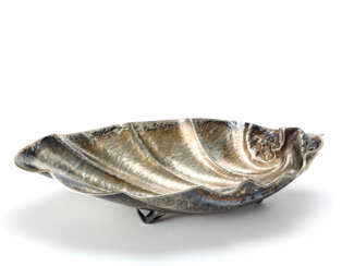 Embossed silver centerpiece in the shape of a shell
