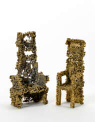 Two bronze sculptures depicting chairs