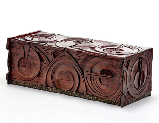 Solid wood chest of drawers decorated in carving with abstract circular and linear motifs, base covered in metal with linear embossed decorations - photo 1