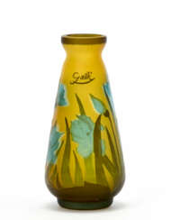Cameo glass vase etched with acid in shades of amber and decorated with floral motif in shades of blue